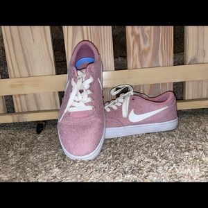 Pink Nike low tops